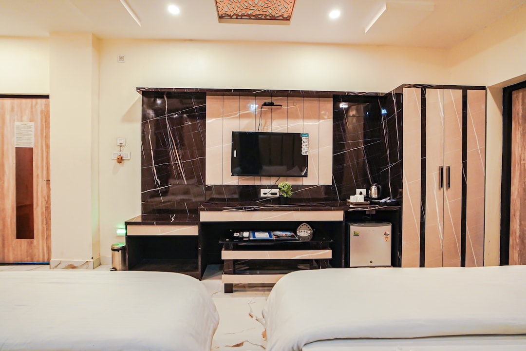 Family Suite — TV and amenities wall